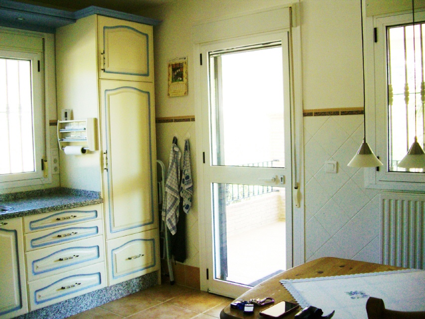 kitchen with door to the balcony