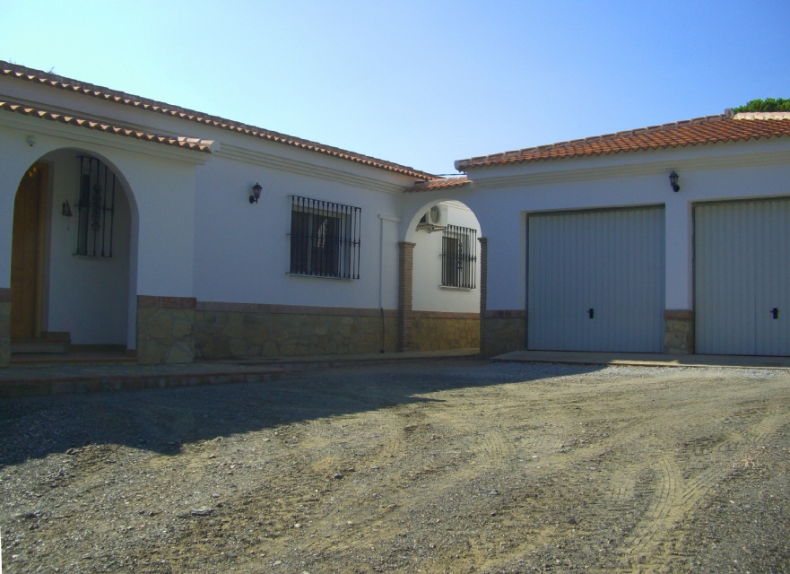 place in front of the garage and the upper entrance door