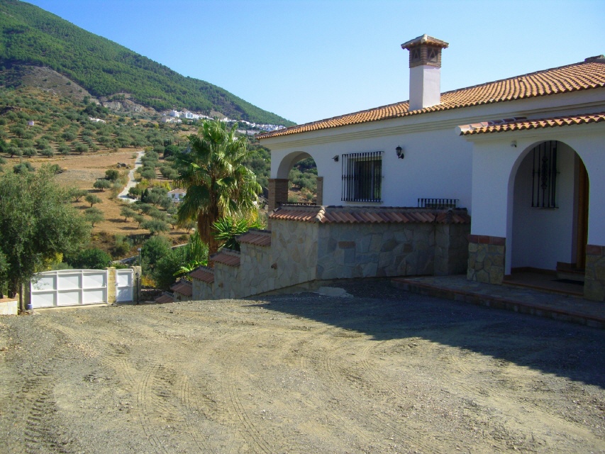 place in front of the garage and the upper entrance door